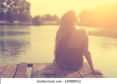 Vintage photo of relaxing young woman in nature - Powered by Shutterstock