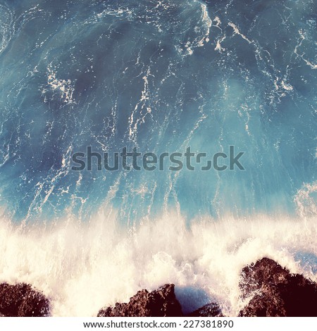Vintage photo sea landscape, wave and rocks, soft pastel colors