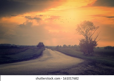 Vintage photo of traffic road in sunset