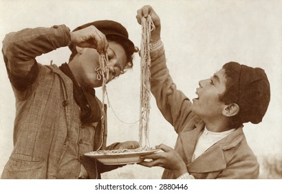 Vintage Photo Of Two Young Boys Eating Spaghetti With Their Hands