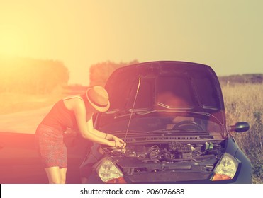 Vintage Photo Of Woman With Broken Down Car In Summer Sunset