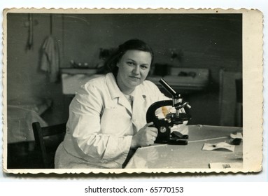 Vintage photo of woman with microscope