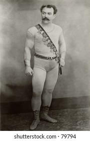 Vintage photo of wrestler with medals