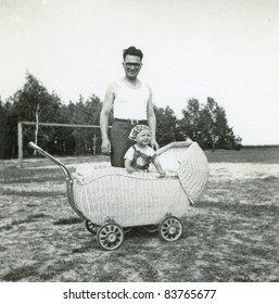 Vintage Photo Of Young Father With Baby Daughter (fifties)