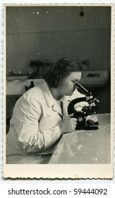 Vintage Photo Of Young Female Doctor With Microscope (early Fifties)