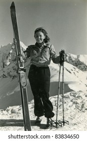 Vintage photo of young female skier (forties)