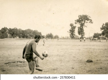 Vintage Photo Of Young Man Playing Football (1960's)