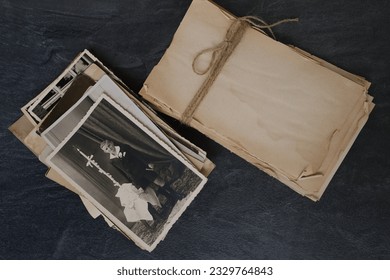 vintage photographs, empty stack rustic aged paper torn off edges for message, designer text, sentimental vintage-inspired mocap, family tree, genealogy, childhood memories, connection with ancestors - Powered by Shutterstock