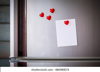 vintage picture tone of Empty paper sheet on refrigerator door. Note paper with magnetic heart. Valentine send text love message.
