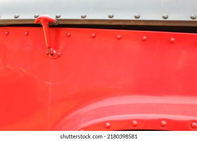 Vintage Piece Of Red Steel Car Body With A Car Hood Hook.