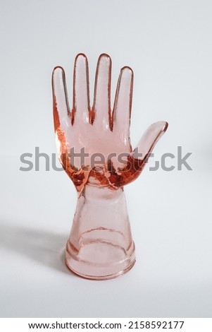 vintage pink depression glass hand, ring model, holder isolated on white