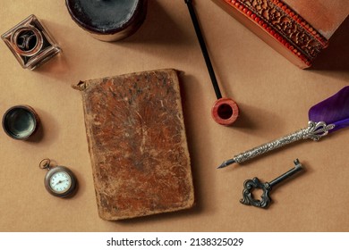 Vintage pipe, notebook, watch and key. Private detective investigation game concept. Overhead flat lay shot on old paper with other retro objects