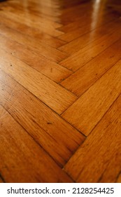Vintage plain wooden parquet floor detail. Hardwood tiles in a seamless pattern.