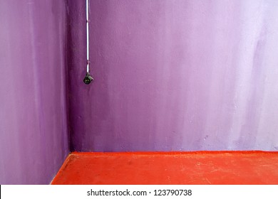 Vintage plug socket in corner of basement room