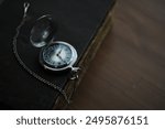 Vintage Pocket Watch on Antique Book - Timeless Elegance and Historic Charm