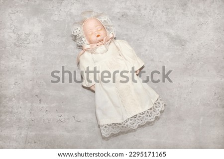 A vintage porcelain sleeping baby doll clean and in good condition.