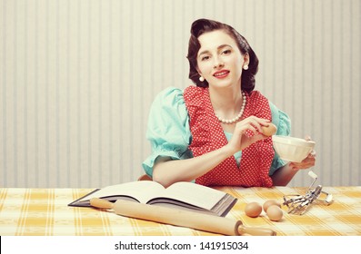 Vintage Portrait Of A Housewife In The Kitchen