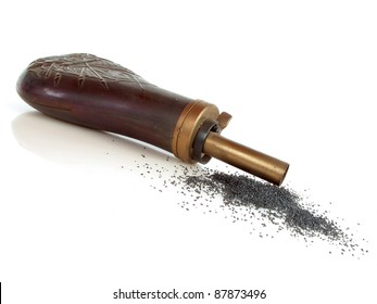 Vintage powder horn with black powder on white