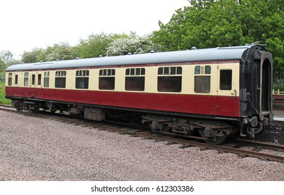 A Vintage Railway Train Carriage Standing At A Platform.