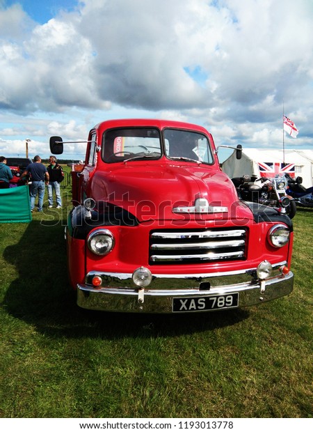 Vintage red Bedford truck show\
outdoor at Northumberland Wings & Wheels festival at Eshott\
Airfield north of Morpeth, England, taken on August 20,\
2017\

