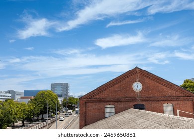Vintage Red Brick Building with Modern Clock - Powered by Shutterstock
