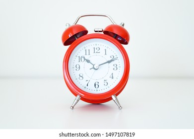 Vintage red clock and alarm clock on white background - Shutterstock ID 1497107819
