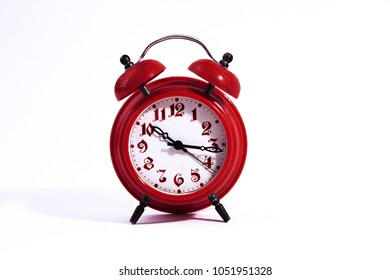 Vintage red clocks. Old red alarm clock. isolated on white background - Shutterstock ID 1051951328