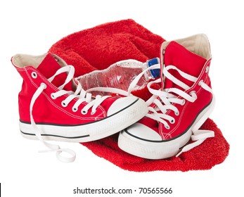 Vintage red shoes with towel on pure white background