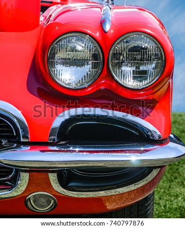 Vintage Red Sports Car front view, headlights and bumper detail