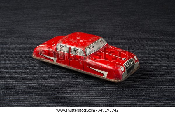 Vintage red tiny toy\
car