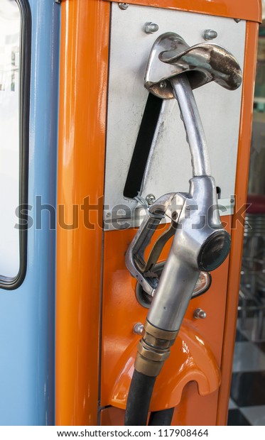 Vintage refuel hose on\
retro gas station