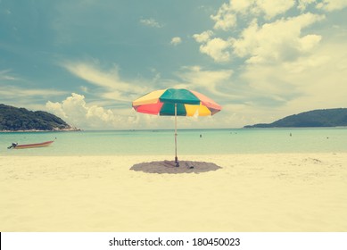 Vintage Retro Beach With Umbrella