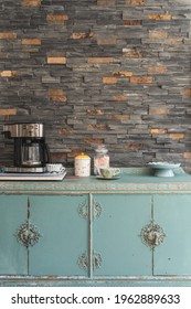 A Vintage, Retro Coffee Station Setup With Teal Cabinet And Brick Wall  In A Cozy Kitchen