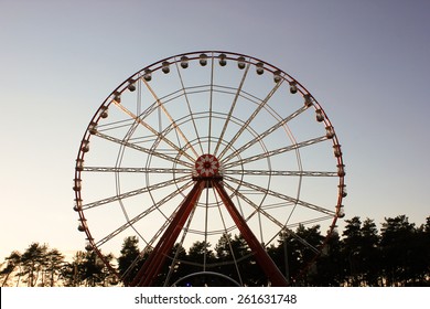 Vintage Retro Ferris Wheel On Blue Sky.  Front View. Ferris Wheel At Amusement Park