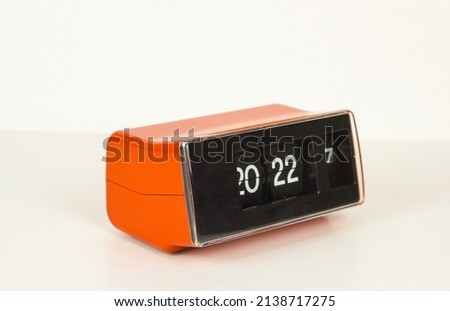 Vintage retro flip alarm flip clock from 70s orange mid century calendar space age