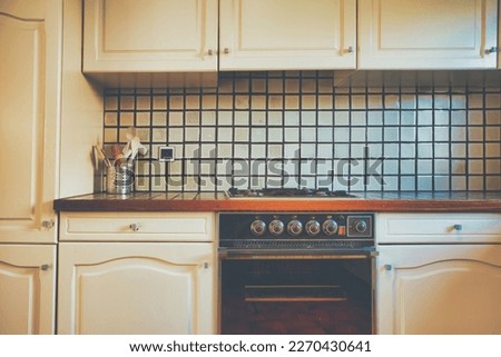 Vintage retro kitchen with green pattern tiles, american retro kitchen home interior design 70's 80's style close-up. retro background