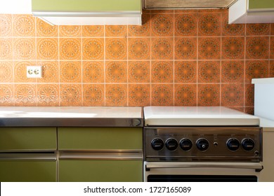 Vintage retro kitchen with orange pattern tiles, american retro kitchen home interior design 70's style close-up - Shutterstock ID 1727165089