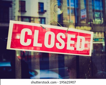 Vintage retro looking Closed sign in a shop showroom with reflections - Shutterstock ID 195625907