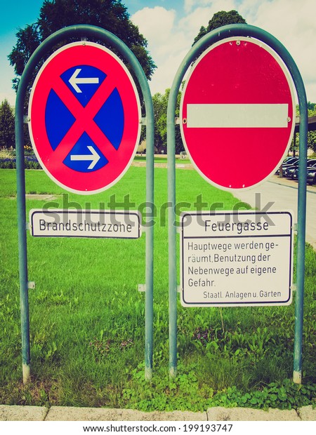 Vintage retro looking A road sign for a no parking\
area and no entry - in\
German
