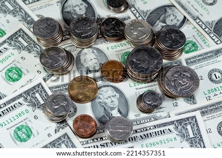 Vintage retro old American money background, United States of America dollars banknotes and pile of American coins of 1 cent, 5, 10, 25 quarter, 50 cents, half dollar coin and one dollar