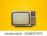 Vintage, retro old TV (television) with blank screen isolated on yellow background, front view, clipping path