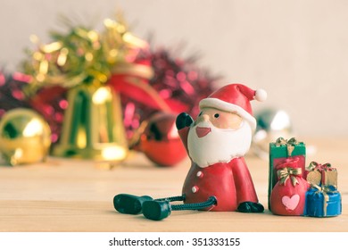 Vintage retro picture style - Santa Claus sitting on wood table