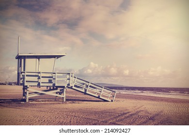Vintage retro picture of wooden lifeguard tower, Beach in California, USA.