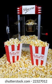 A Vintage Retro Popcorn Machine Over Black Background