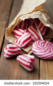 Vintage Rock Candy In A Paper Cone On A Wooden Desk