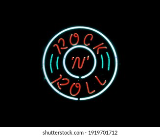 Vintage Rock N Roll Neon Sign On Black Background                               