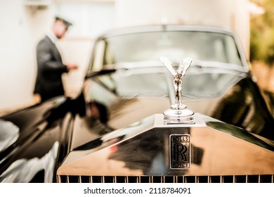 vintage rolls royce wedding car with driver to take the bride and groom - Shutterstock ID 2118784091