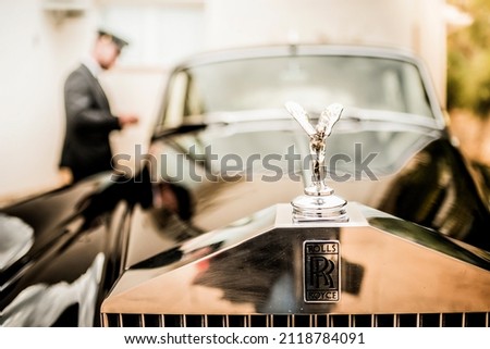 vintage rolls royce wedding car with driver to take the bride and groom