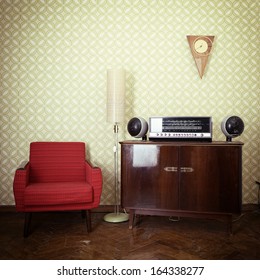 Vintage Room With Wallpaper, Old Fashioned Armchair, Retro Player, Loudspeakers, Clocks And Standart Lamp, Toned