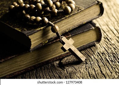 Vintage Rosary Beads On Old Books